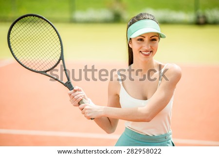 Tennis contest. Female player at the clay tennis court