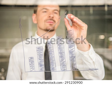 Business man drawing a rising arrow, representing business growth.