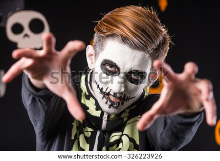 Portrait of a man in a Halloween costume. Skeleton. Studio portrait on black background