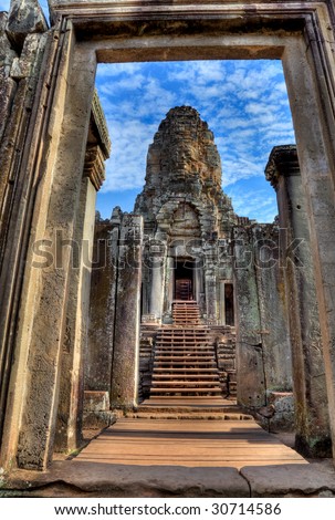 view through door entrance to a statue of bayon temple in angkor wat - Cambodia (HDR)