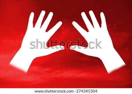 The white palm hand on red dark background