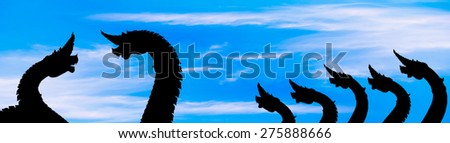 The naga black silhouette on blue sky cloud background