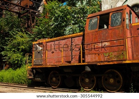 Rostov - on - Don, Russia - August 09, 2015: Old rusty Russian train in the territory of thrown factory, established near Green Island in Rostov - on - Don.