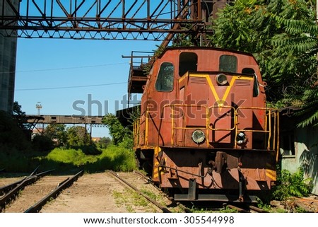 Rostov - on - Don, Russia - August 09, 2015: Old rusty Russian train in the territory of thrown factory, established near Green Island in Rostov - on - Don.