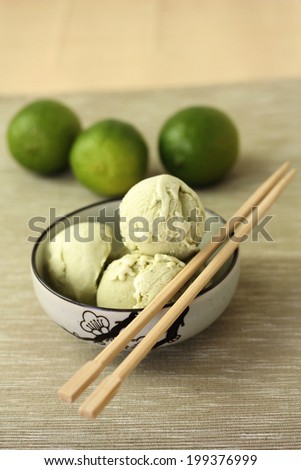lime ice cream in east style and fresh limes