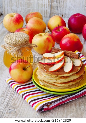 Fresh homemade pancake with apples, honey and cinnamon Ã?Â�Ã?Â¾Ã?Â?? wooden background