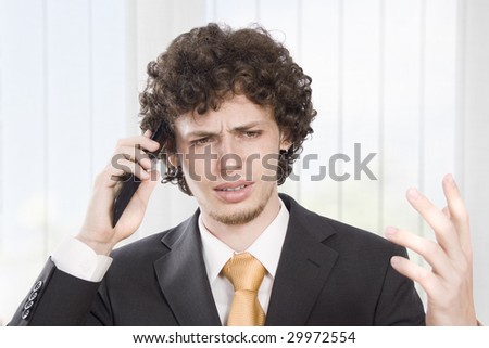 Angry businessmen explains in the phone