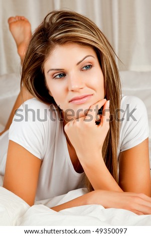 Young beauty woman couch in the bed and daydreaming
