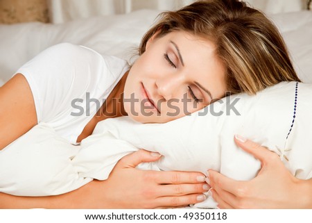Young beauty woman couch in the bed and sleeping