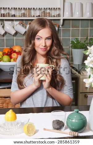 Pretty woman drinking green tea