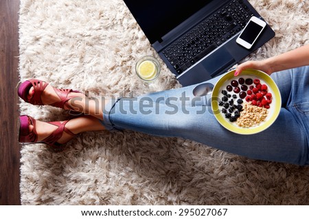 Woman taking a selfie of her healthy snack