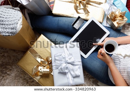 Woman shopping online with a credit card