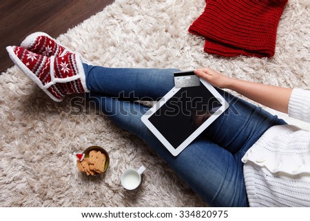 Woman taking a selfie while online shopping