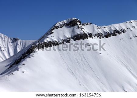 Off piste slope with traces of avalanches. Caucasus Mountains, Georgia, ski resort Gudauri.