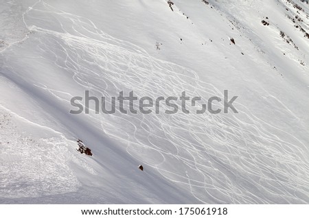 Tracks on off-piste ski slope, freeriding. Caucasus Mountains, Georgia, ski resort Gudauri.