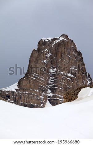 Snow rocks and gray sky. Turkey, Central Taurus Mountains, Aladaglar (Anti Taurus) view from plateau Edigel (Yedi Goller)
