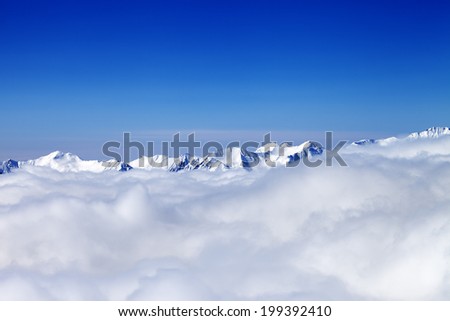 Cloudy mountains at nice winter day. Caucasus Mountains, Georgia, ski resort Gudauri.