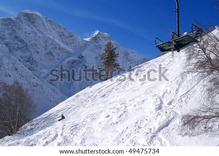 Old chair lift at ski slope of Cheget. Caucasus Mountains.