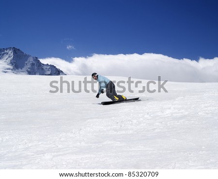 Snowboarding in mountains. Caucasus Mountains, Dombay