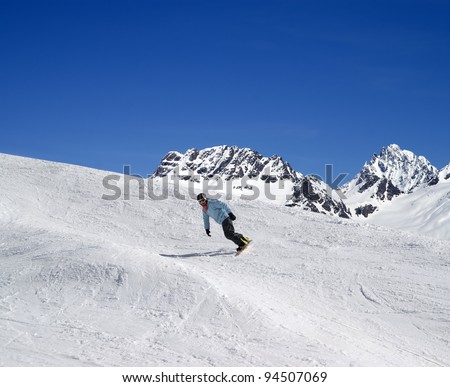 Snowboarding in high mountains
