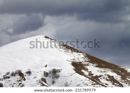 Off piste slope and overcast gray sky. Caucasus Mountains, Georgia, ski resort Gudauri.