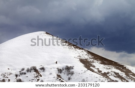 Off-piste slope and overcast gray sky. Caucasus Mountains, Georgia, ski resort Gudauri.
