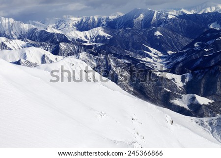 Off-piste slope and snowy mountains. Caucasus Mountains, Georgia. Ski resort Gudauri.
