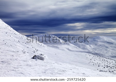 Winter mountains and storm sky. Ukraine, Carpathian Mountains.