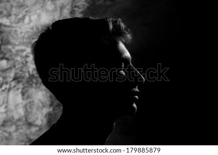 contrast silhouette profile of a young man in the style of yin and yang