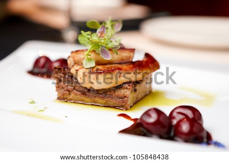Fried foie gras with cherry sauce and figs