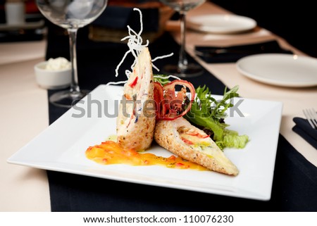 Stuffed chicken fillet with cheese trio, kumquat sauce and nutty rice