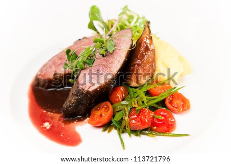 Glazed duck fillet, mashed potatoes seasoned with truffle oil, fig and aniseed sauce