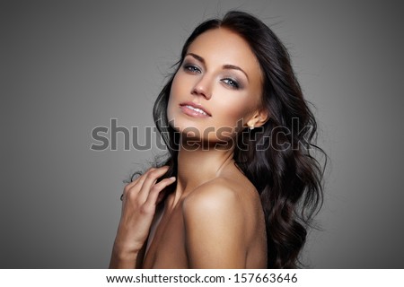 Portrait Of Beautiful Female Model On Gray Background