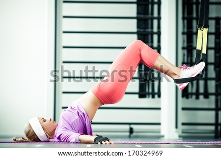 Young woman streching muscles functional training Young woman streching muscles functional training