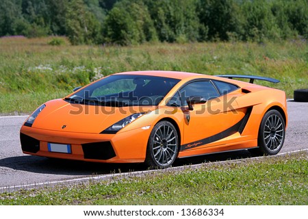 2007 A Driver Operates An Orange Lamborghini Gallardo Superleggera On A