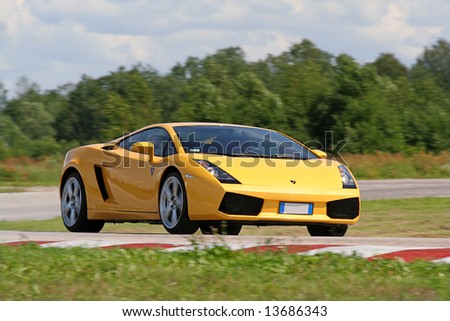 Estonia July 12 2007 A Driver Operates A Yellow Lamborghini Gallardo