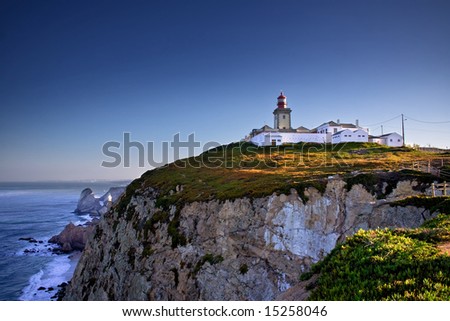 Dramatic view of cliffs and lighthouse on Cabo da Roca cape in Portugal on sunrise