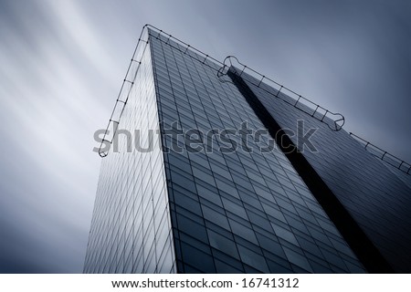 Detail of modern skyscraper. Psychedelic sky.