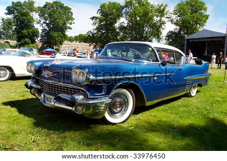  18 American Beauty Car Show Showing Blue 1958 Cadillac Coupe De Ville 