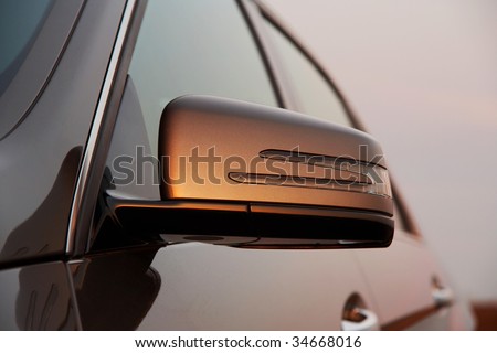 Car rear view mirror closeup