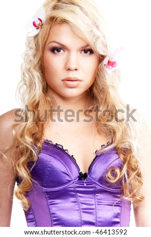 Young lady in corset with orchids in her hair