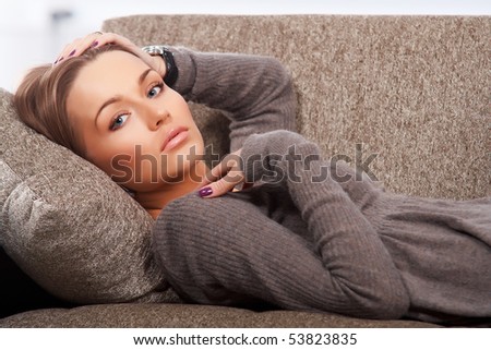 Beautiful woman lying on the couch
