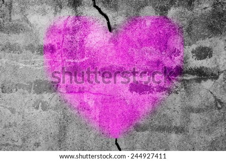 Love is heal: Purple spray on concrete wall