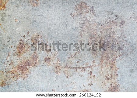 Brown rust stains on polished old grey concrete floor.