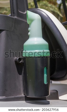 Plastic bottle put sand on a golf cart