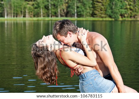 Happy couple enjoying their time together in the montain lake