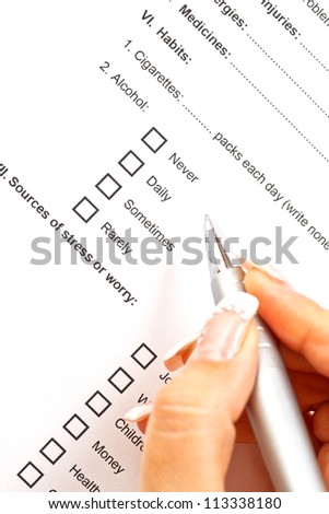 Woman filling the medical history questionnaire