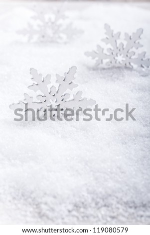 Artificial snowflake on snow. Winter background