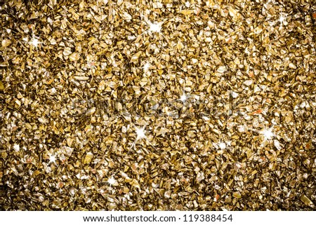Artificial gold ornaments background with sparkling