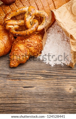 Baked goods on old wooden background